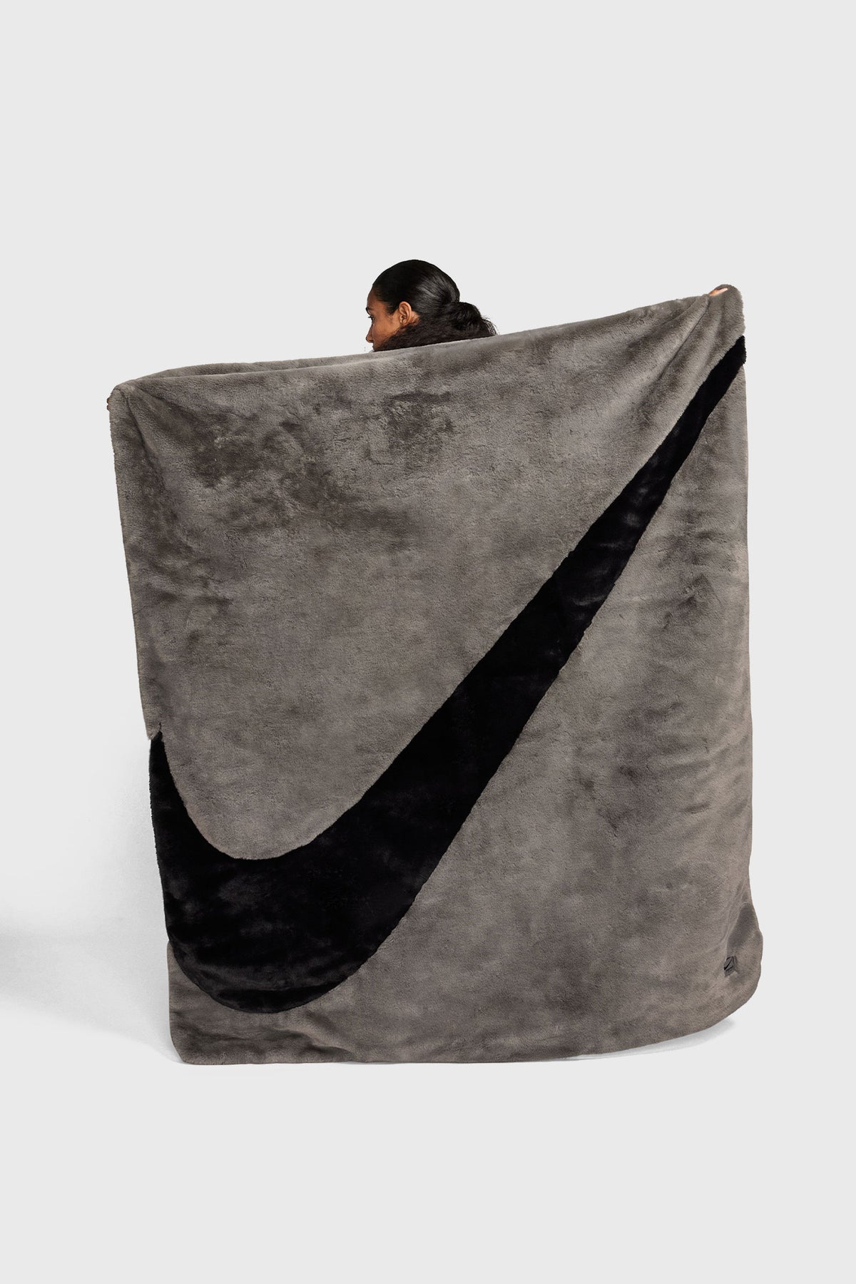 nike blanket backpack SPORTSWEAR FAUX FUR BLACK Hush Life Boutique The blankets center holds the seventh peak Nike Phoenix Cozy Boucle Blanket